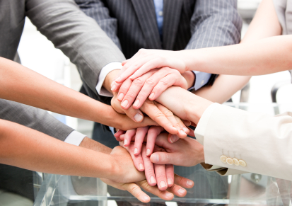 stock-photo-13081344-close-up-of-a-multi-ethnic-partners-with-hands-together